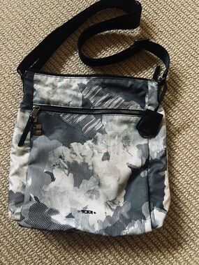Tumi Voyager Crossbody Bag in grey floral watercolor.